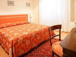 A bed or beds in a room at Casa Isolani Luxury Rooms Piazza Maggiore 1