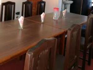 a wooden table with some candles on top of it at HOTEL FABULOUS KASHMIR, Dal lake in Srinagar