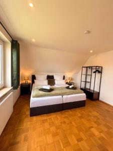 a bedroom with a large bed in a room at Deluxe Apartment in Jettingen-Scheppach