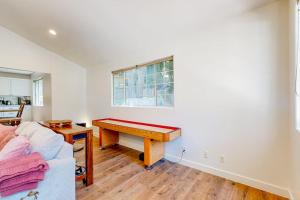 a living room with a desk and a table at Lake Gregory Escape in Crestline