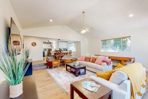 a living room with a couch and a table at Lake Gregory Escape in Crestline