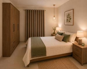 a bedroom with a large bed and a window at Luna Suites in St. Julianʼs