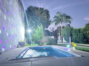 a swimming pool in front of a house at Los Nardos in San Nicolás de los Arroyos