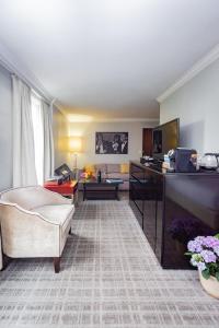 a living room with a couch and a table at The Graham Georgetown in Washington, D.C.