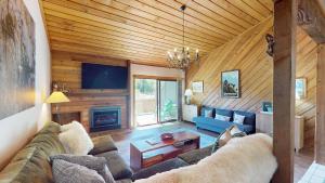 a living room with a couch and a fireplace at Ridge Condo 2610 in Sun Valley