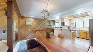 a kitchen and dining room with a wooden table at Ridge Condo 2610 in Sun Valley