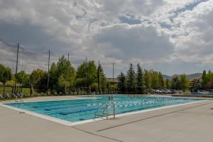 a large swimming pool with people in the water at Ridge Condo 2610 in Sun Valley