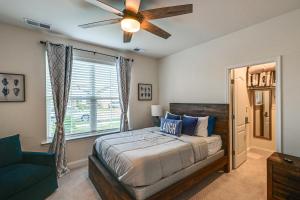 a bedroom with a bed and a ceiling fan at Beach Shuttle! Spacious Bishop’s Landing Retreat in Ocean View +40 photos
