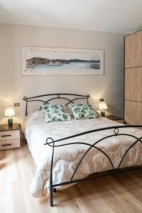 a bedroom with a bed with two pillows at Aethalia Bed and Breakfast in Portoferraio +108 photos