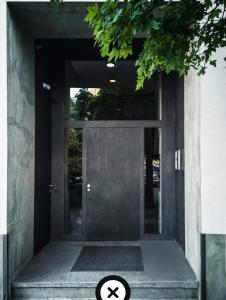 a door to a building with a sign in front at iRelax studio - privatni wellness in Prague