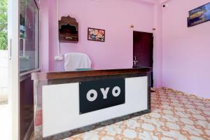 aiya sign on a counter in a pink room at SPOT ON S.S HOTEL in Lucknow +34 photos