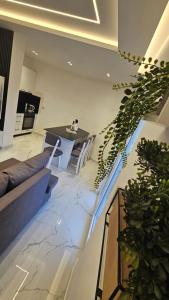 a living room with a couch and a table at DLE Murtic in Shëngjin