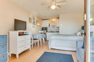 a bedroom with two beds and a kitchen at Old Orchard Beach Condo: Steps From the Beach! in Old Orchard Beach