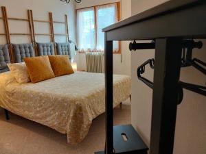 a bedroom with a bed and a tv in a room at Best Biescas Tourist Home in Biescas +42 photos