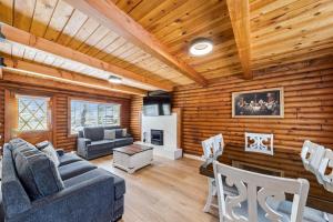 a living room with a couch and a table at Twin Peaks Cabin in South Lake Tahoe