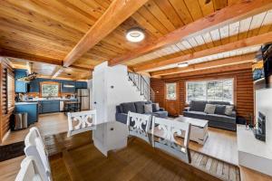 a living room and kitchen with wooden ceilings at Twin Peaks Cabin in South Lake Tahoe