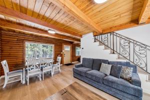 a living room with a couch and a table at Twin Peaks Cabin in South Lake Tahoe