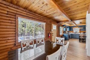 a dining room with a table and chairs and a window at Twin Peaks Cabin in South Lake Tahoe +24 photos