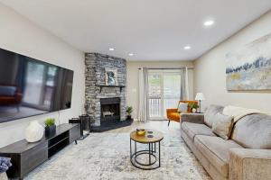 a living room with a couch and a fireplace at Elevation Hideaway in Durango Mountain Resort
