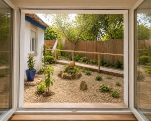 a view of a garden through a window at DUNA - Escapada romántica en Punta Paloma in Tarifa