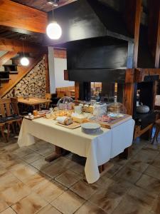 a table with food on it in a kitchen at Hôtel-Restaurant Mélèze Grimentz in Grimentz