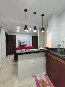 a kitchen with two plates on a counter in a room at Recanto dos sabias AP01 in Conservatória