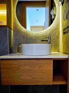 a bathroom with a sink and a mirror at Prestige studio in Maarif +40 photos