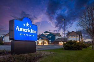 a sign in front of a building at AmericInn by Wyndham Appleton North Little Chute in Appleton