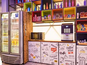 a grocery store with a refrigerator and a microwave at ibis Budget Barranquilla in Barranquilla +63 photos