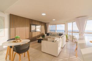 a living room with a couch and a table at Seacrest 9 in Gold Coast