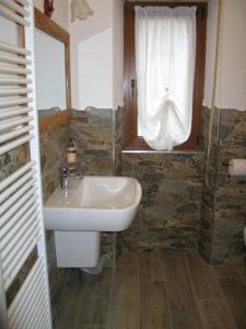 Koupelna v ubytování B & B Le Riue