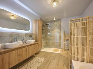 a bathroom with two sinks and a shower at t Margrietje in Riemst +54 photos