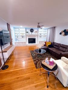 a living room with a couch and a table at Comfort Cove Snellville in Snellville