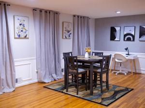 a dining room with a table and chairs at Comfort Cove Snellville in Snellville