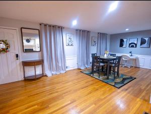 a living room with a table and a dining room at Comfort Cove Snellville in Snellville +20 photos