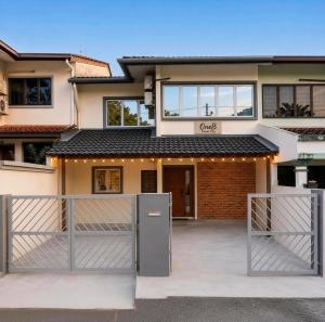 a house with a gate in front of it at Homestay Shah Alam OneB, 2-12 pax, I-city & UiTM in Shah Alam