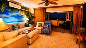 a living room with a couch and a table at Kona Plaza#409 in Kailua-Kona