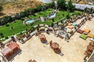 an aerial view of a patio with a pool and a park at Goreme Inn Hotel Only Adult in Göreme
