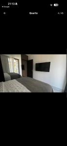 a picture of a bedroom with a bed and a window at Gave risort Porto life 2 in Porto De Galinhas +3 photos