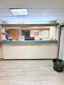 an office lobby with a counter and a reception desk at COLLINS INN & SUITES in Collins