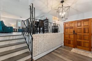 a staircase in a room with a stair case at Arden Place - Spacious Retreat with Pool in High Point