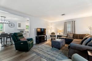a living room with a couch and a table at Arden Place - Spacious Retreat with Pool in High Point
