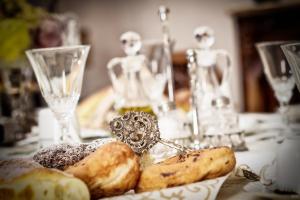 a table with a plate of pastries on a table at Roccamelia Experience in Mazara del Vallo