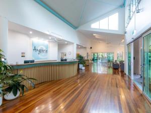 an empty lobby with a bar in a building at NRMA Angourie Resort, Yamba in Yamba +56 photos