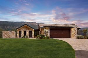 a stone house with a garage at Villa Arbosana in Barrengarry +7 photos