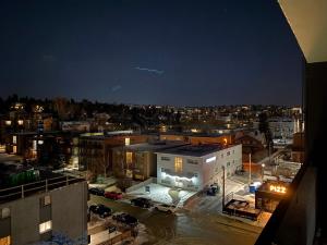 a view of a city at night at Bold property in Calgary