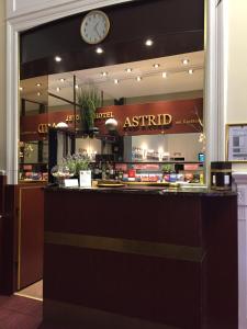 a store front with a clock on the wall at Hotel Astrid am Kurfürstendamm in Berlin