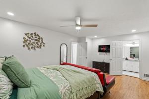 a bedroom with a bed and a ceiling fan at Relaxation spot lawrenceville in Lawrenceville