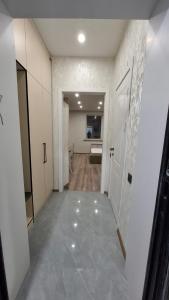 an empty room with a hallway with a door at ЖК Табигат in Borovoye