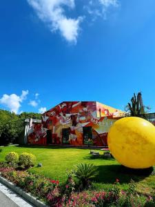 a building with a large yellow sphere in front of it at W9-Hotel ShangHai PuDong Airport - 24 hours free shuttle bus to Pudong Airport in Shanghai